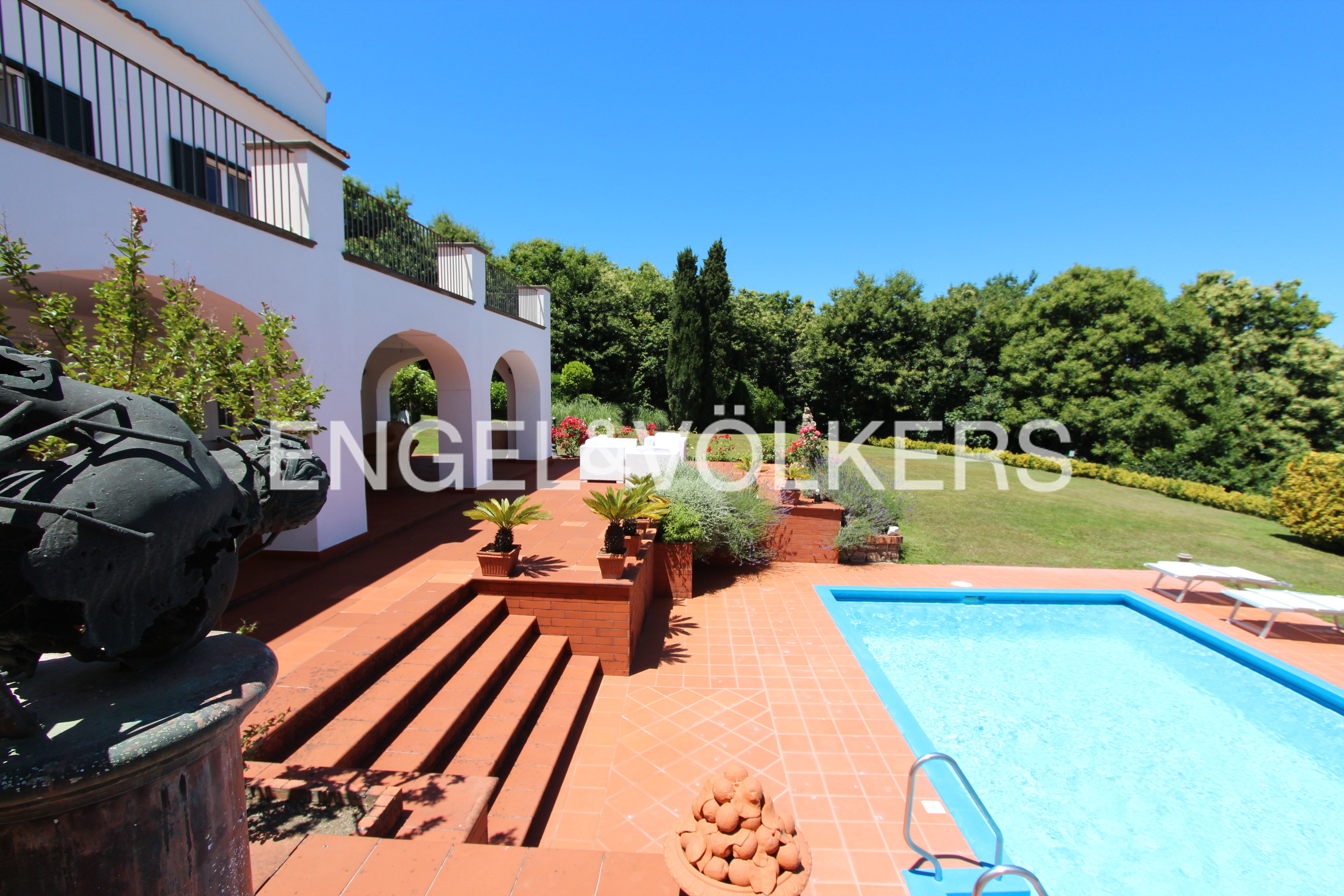 Charming villa with breathtaking views of the azure sea and lush greenery.