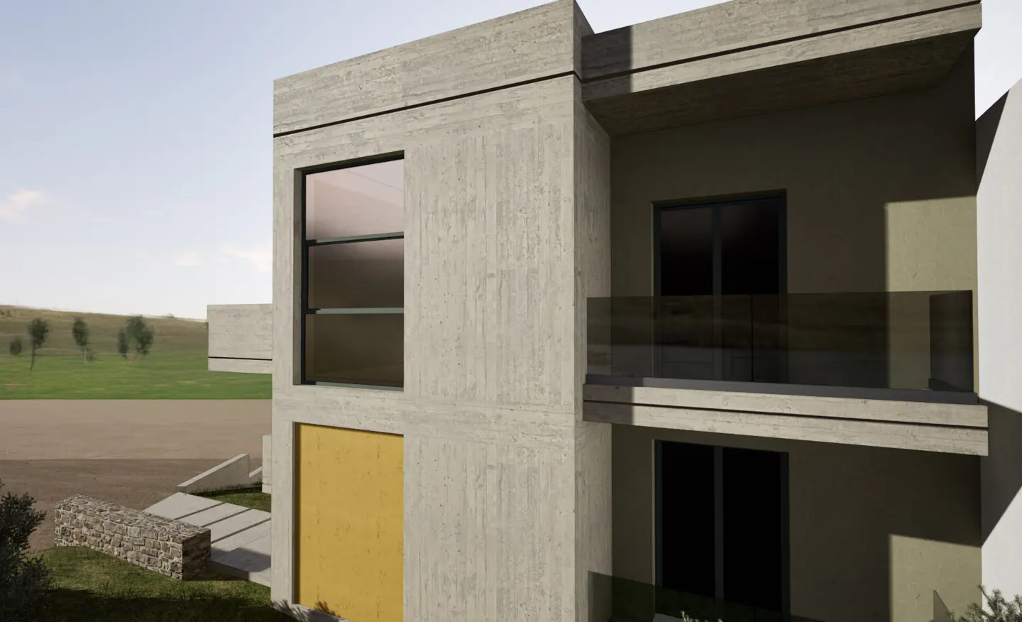 Modern two-story concrete home with a yellow accent panel, glass balcony, and large windows overlooking a grassy field.