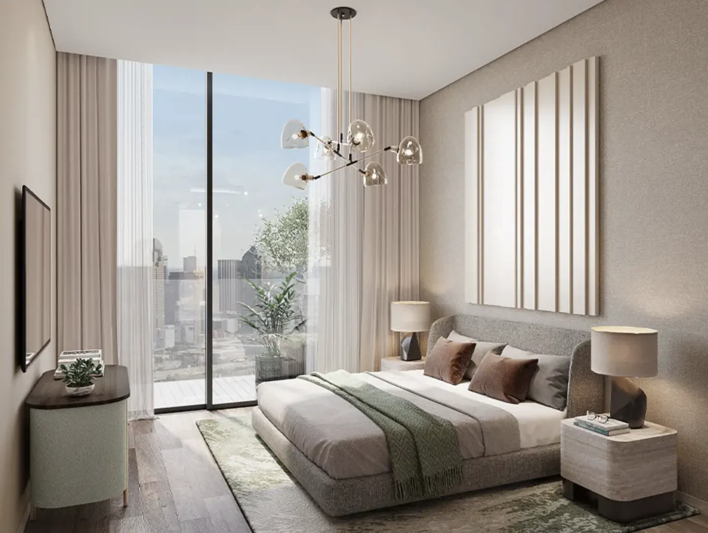 Modern bedroom with a grey upholstered bed, green throw, sculptural chandelier, and floor-to-ceiling city view window.