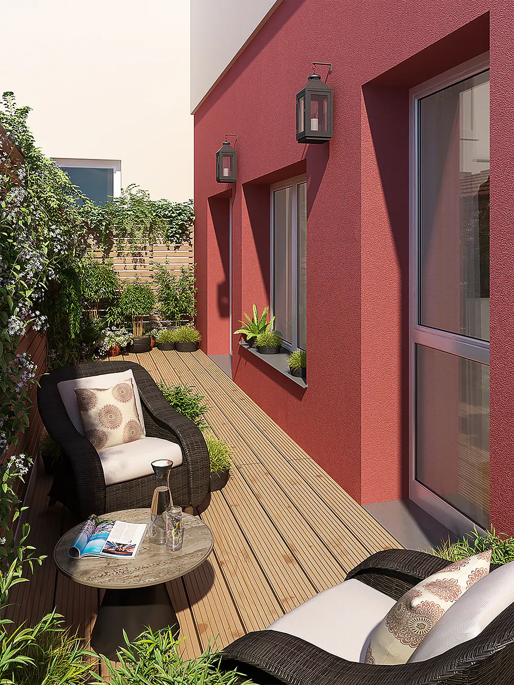 Outdoor patio with wicker furniture, wooden deck, and lush greenery. Red building with windows and lanterns in the background.