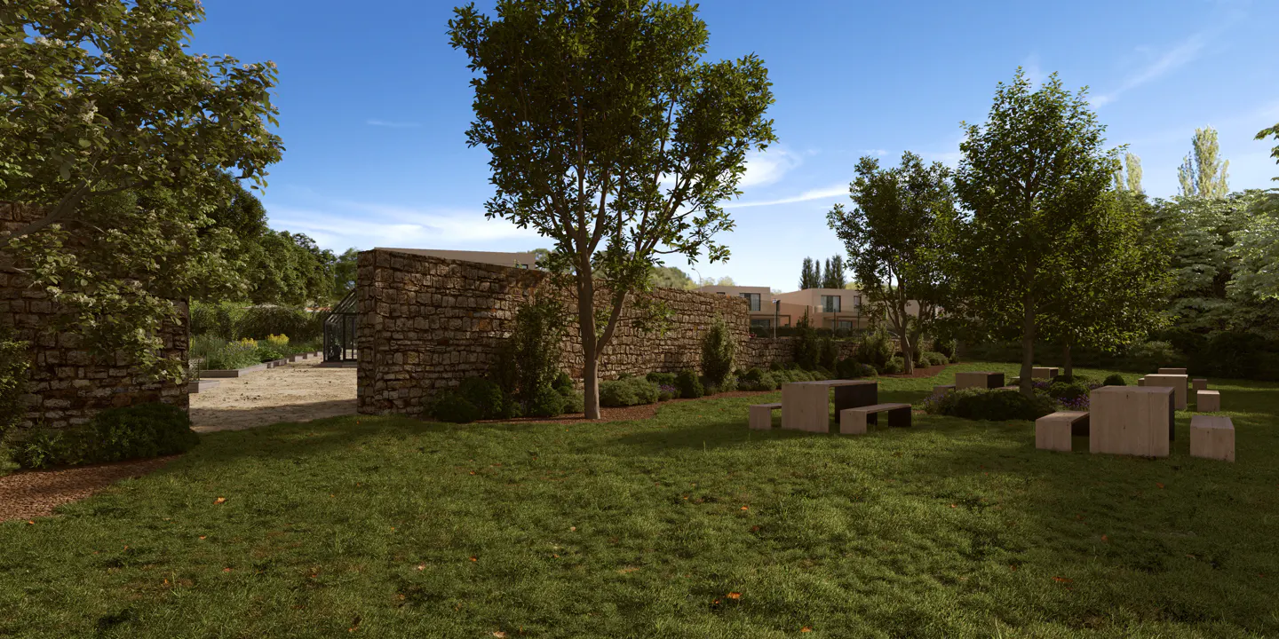 Lush green lawn with stone benches and tables, framed by trees and a stone wall under a blue sky.