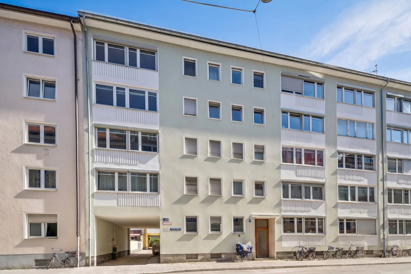 Exterior view of the residential building, looking toward the passageway to the courtyard