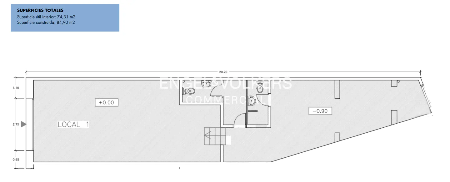 Floor plan of commercial space with two bathrooms, stairs, and dimensions. Text indicates total area.