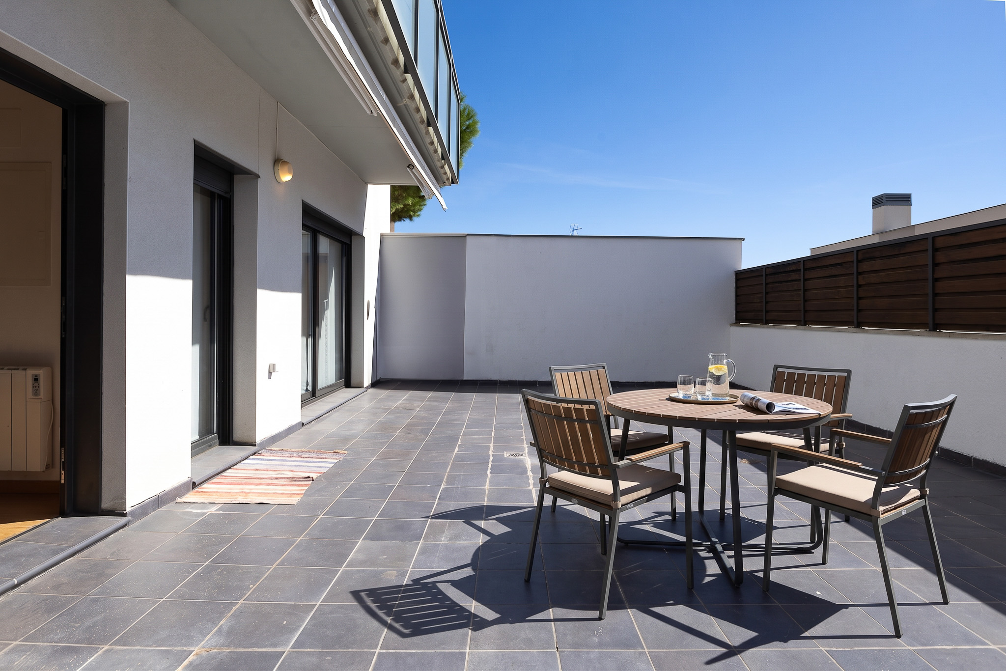 Exclusive apartment in the center of Premià de Dalt with a 50 m² private terrace, parking space, and storage room. [AI-modified]