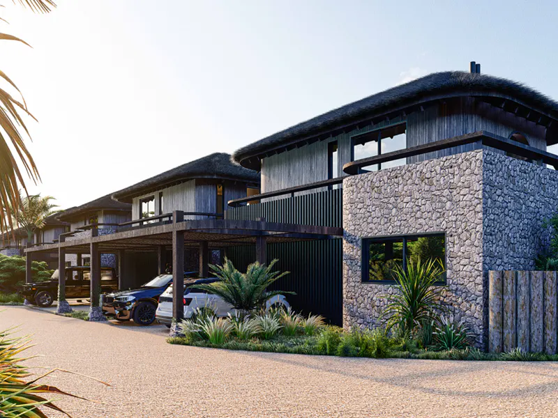 Exterior view of modern homes with thatched roofs and stone accents, cars parked underneath wooden carports.