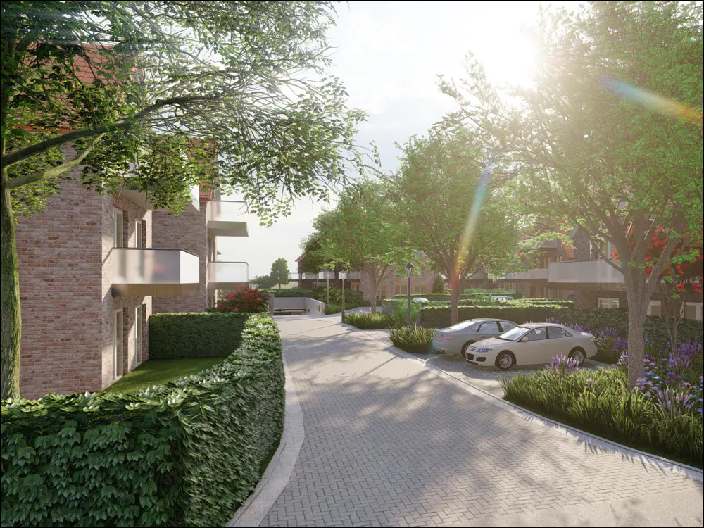 Brick apartment building with balconies, green trees, and parked cars on a sunny day.