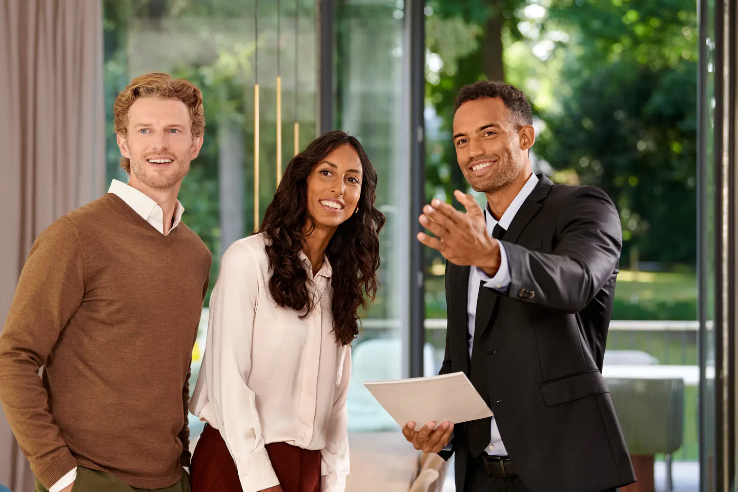 Real estate agent showing a property to a couple