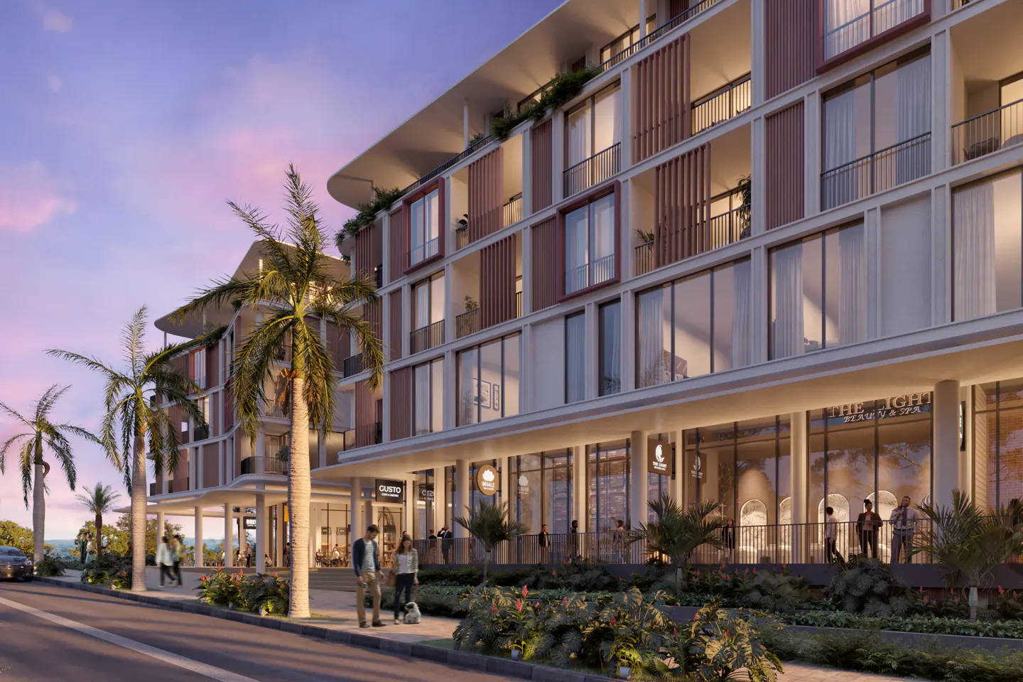 Modern multi-story building with shops on the ground floor at dusk. Palm trees line the street with people walking.