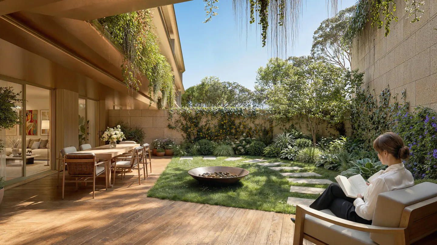A woman reads on a patio with a garden, stone path, and fire pit. The building is tan with hanging plants.