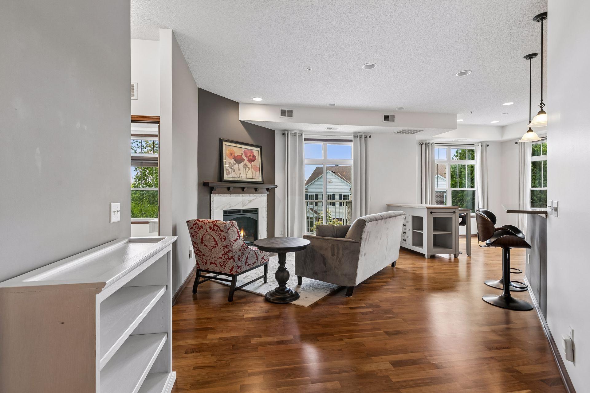 Refined End-Unit Condo: 10' Ceilings & Private Porch