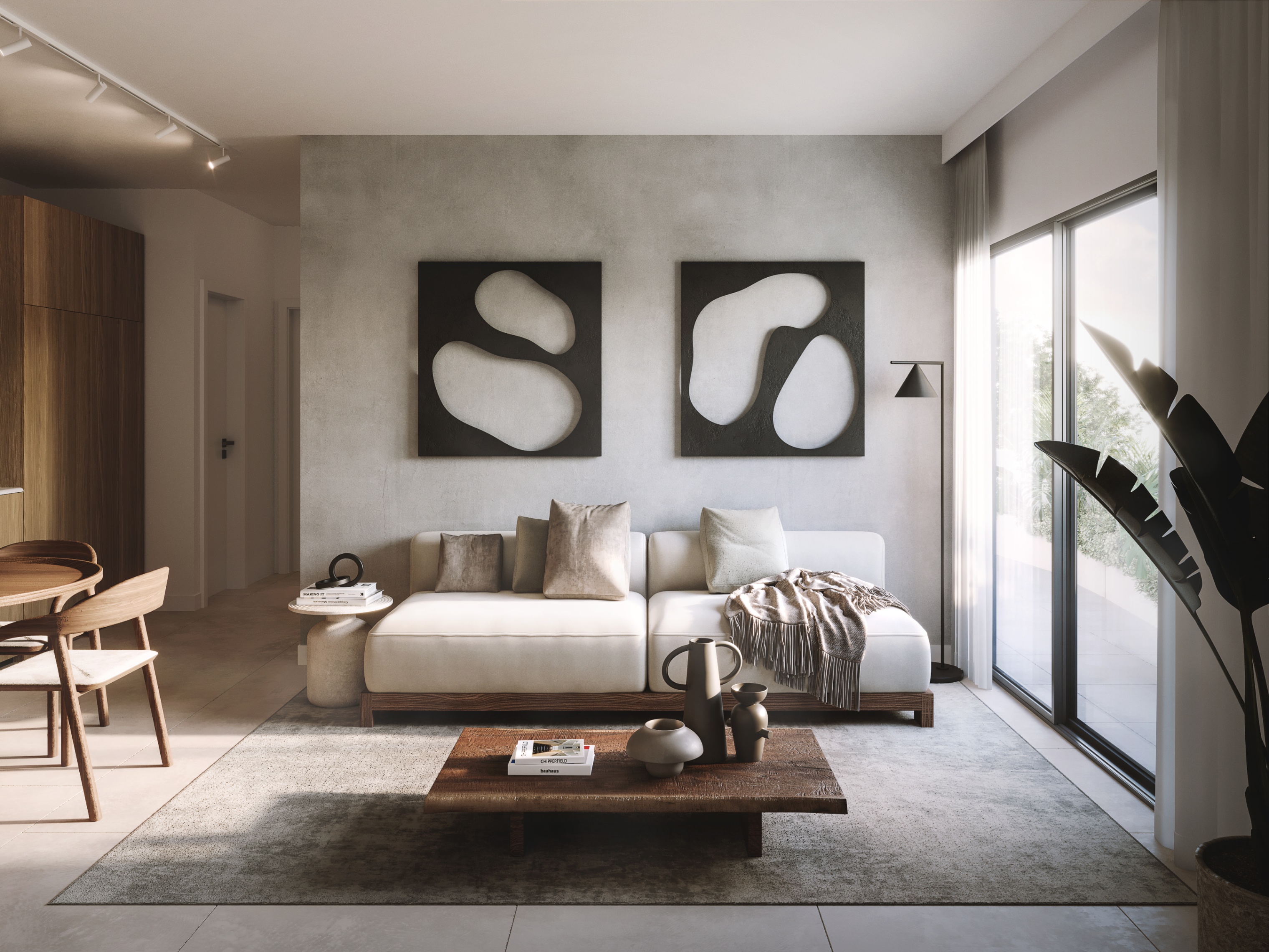 Living room with a white sofa, wood coffee table, and abstract art on a gray wall. Large windows let in natural light.