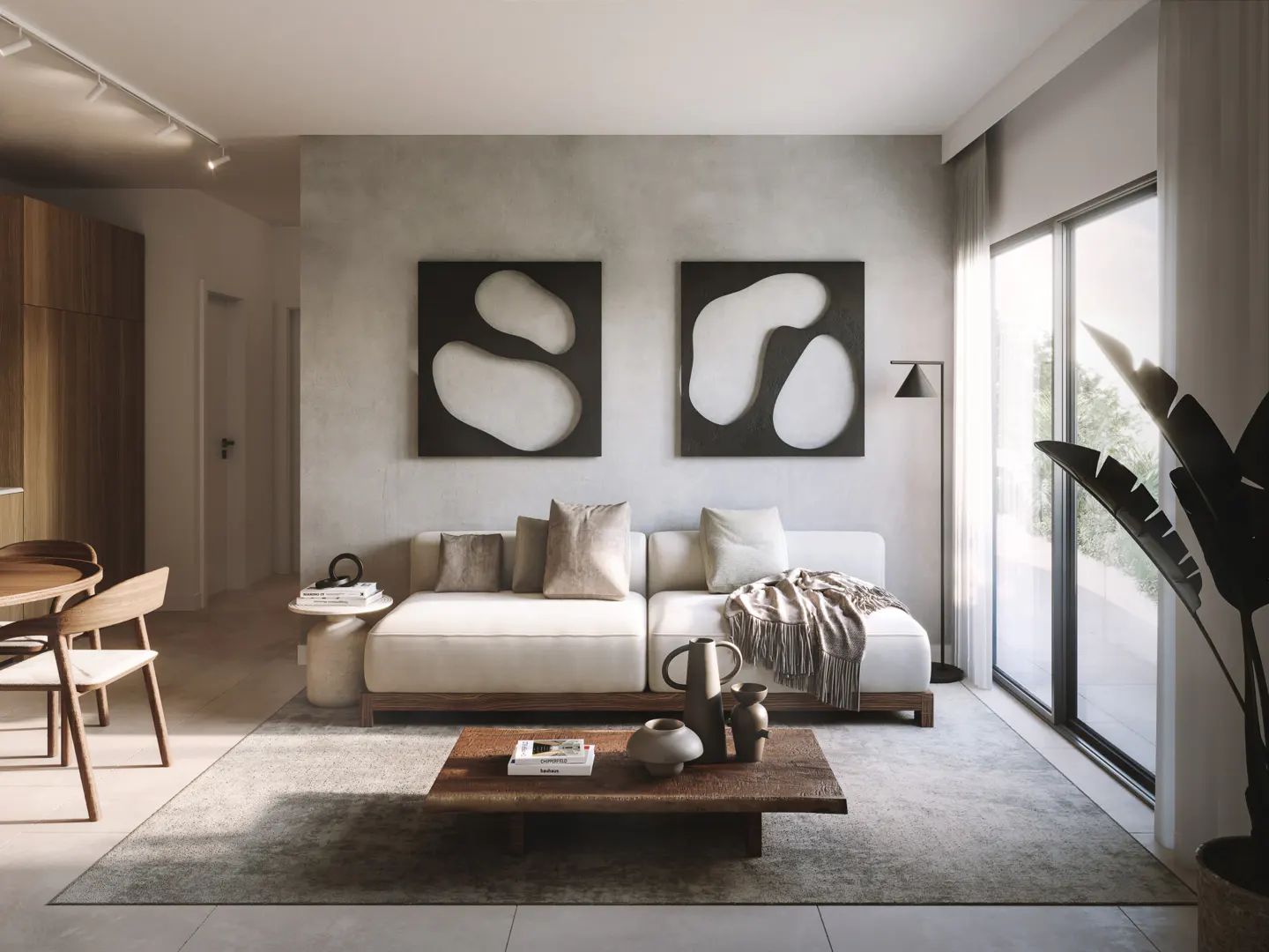 Living room with a white sofa, wood coffee table, and abstract art on a gray wall. Large windows let in natural light.