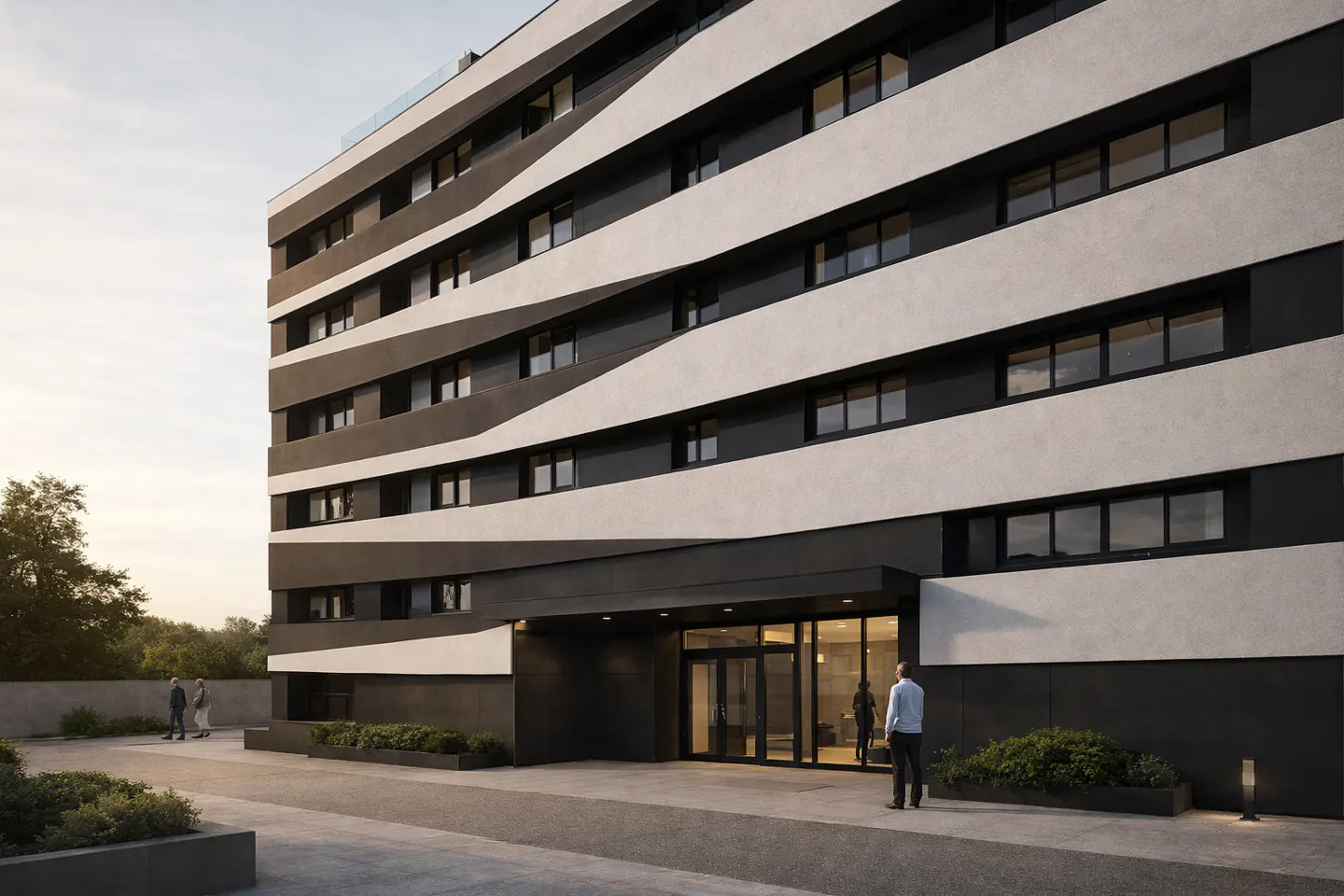 Modern apartment building with black and white horizontal stripes. A man stands near the glass entrance doors.