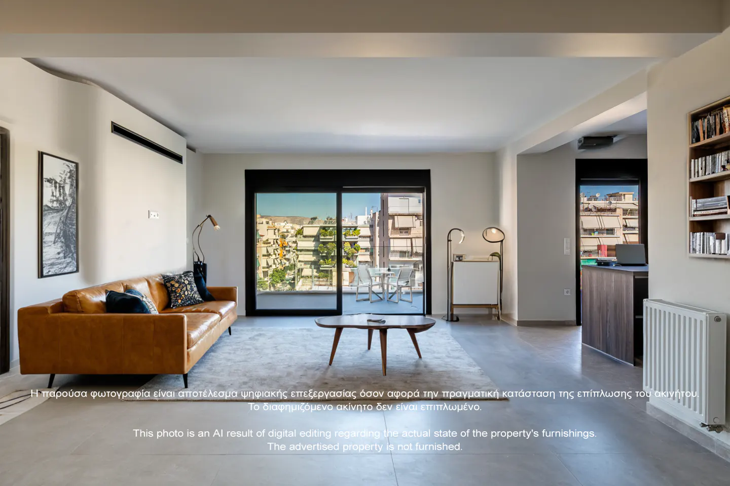 Living room with a brown leather sofa, coffee table, and balcony with city views. The walls are white and the floor is gray.