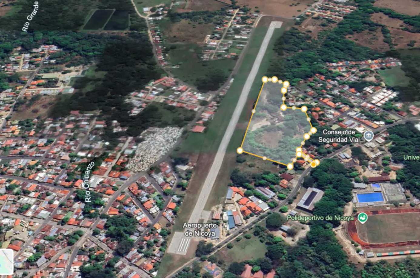 Aerial view of Nicoya, Costa Rica, featuring a property outlined in yellow near the Aeropuerto de Nicoya and Polideportivo de Nicoya.