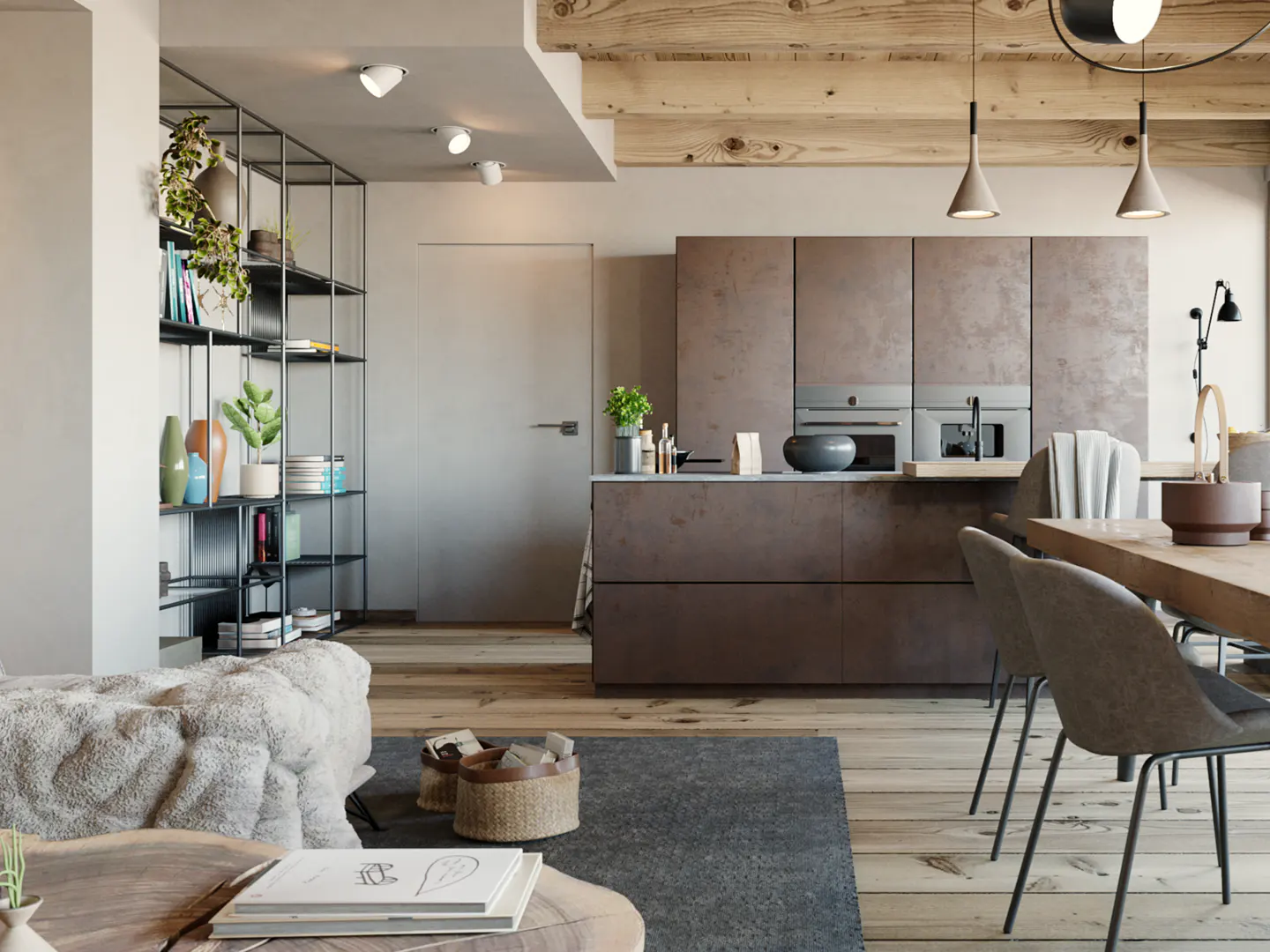 A modern open-concept living space with a kitchen, dining area, and living room. The kitchen has brown cabinets and stainless steel appliances.