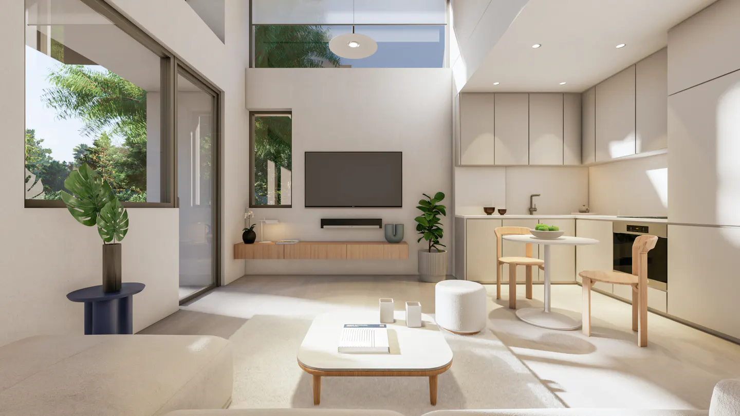 A bright, modern living space with a TV, kitchen, and large windows. A white sofa and coffee table are in the foreground.