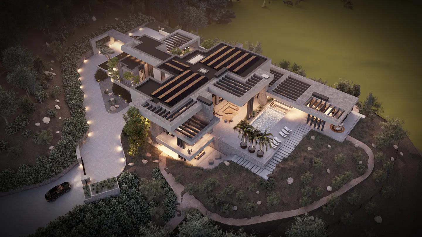 Aerial view of a modern concrete luxury villa at dusk, featuring a swimming pool, palm trees, and a winding driveway.