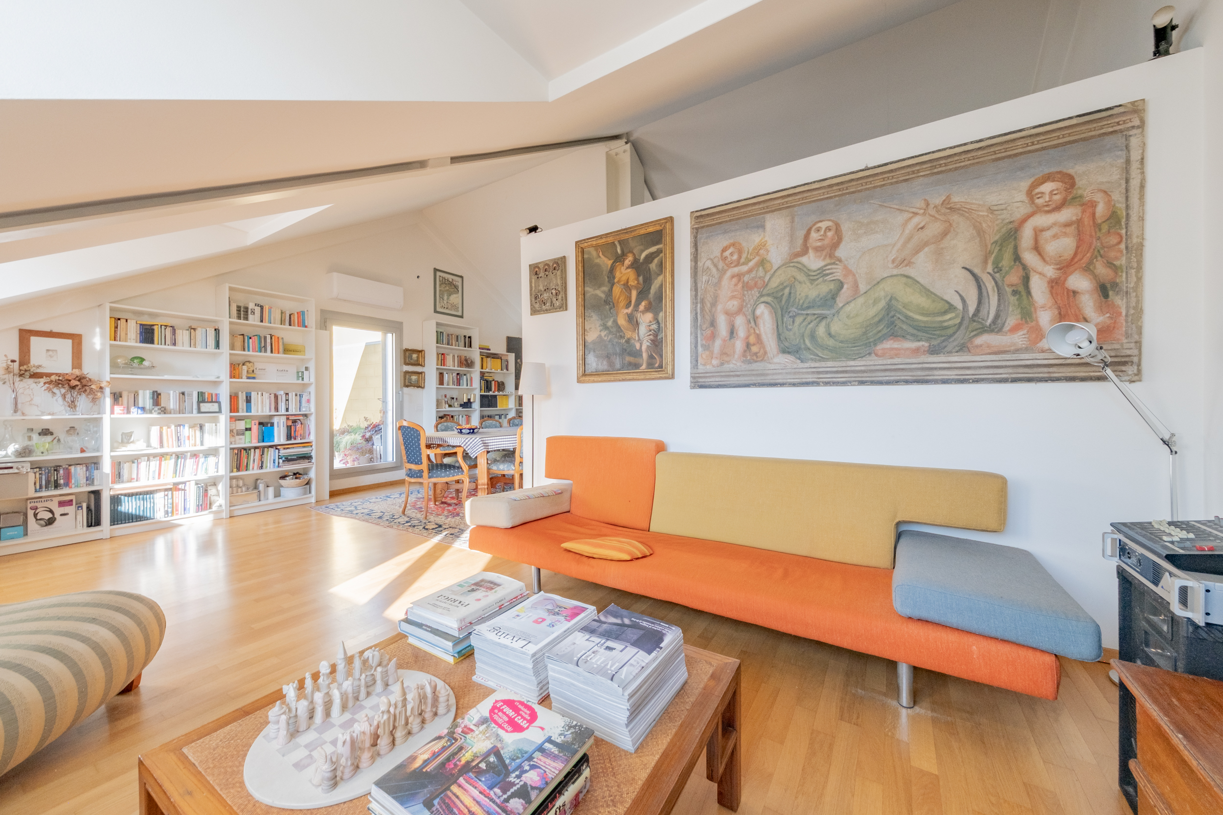 Bright penthouse with terraces near Fondazione Prada