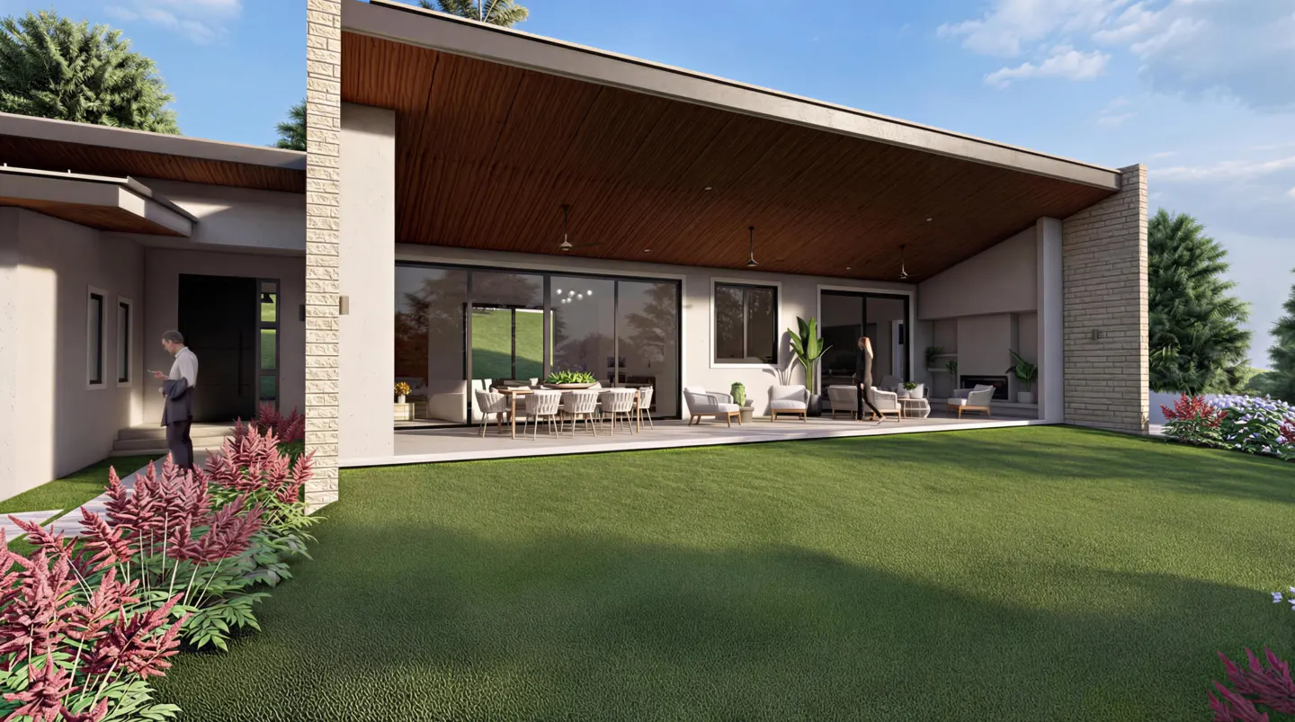 Modern home exterior with a large patio, dining table, and green lawn. A man stands at the front door.