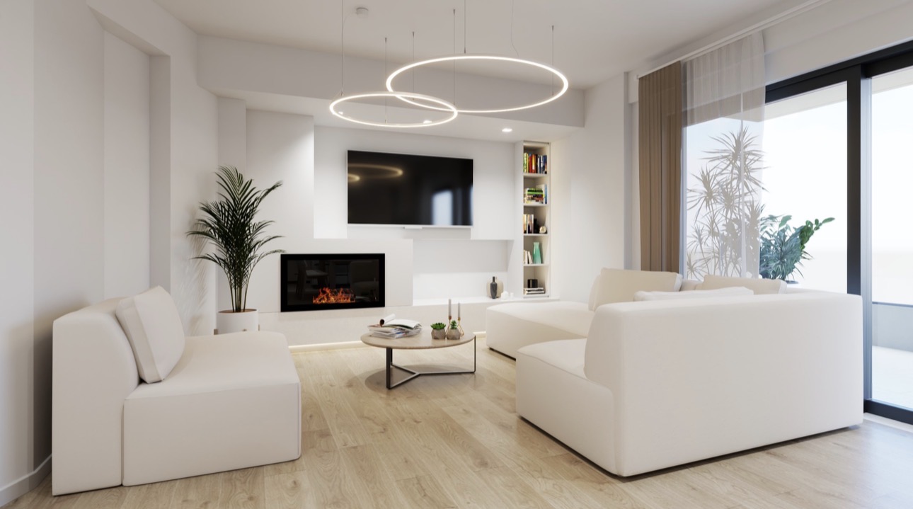 Modern white living room with a fireplace, wall-mounted TV, circular pendant lights, and a cozy sectional sofa.