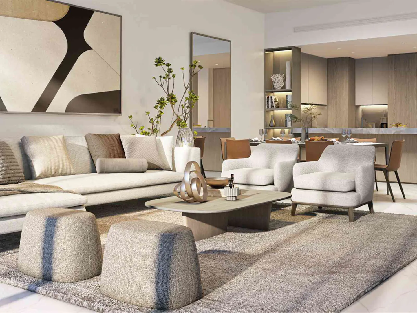 Living room with a beige sectional sofa, two gray ottomans, and a gray rug. There are two white armchairs and a dining table in the background.