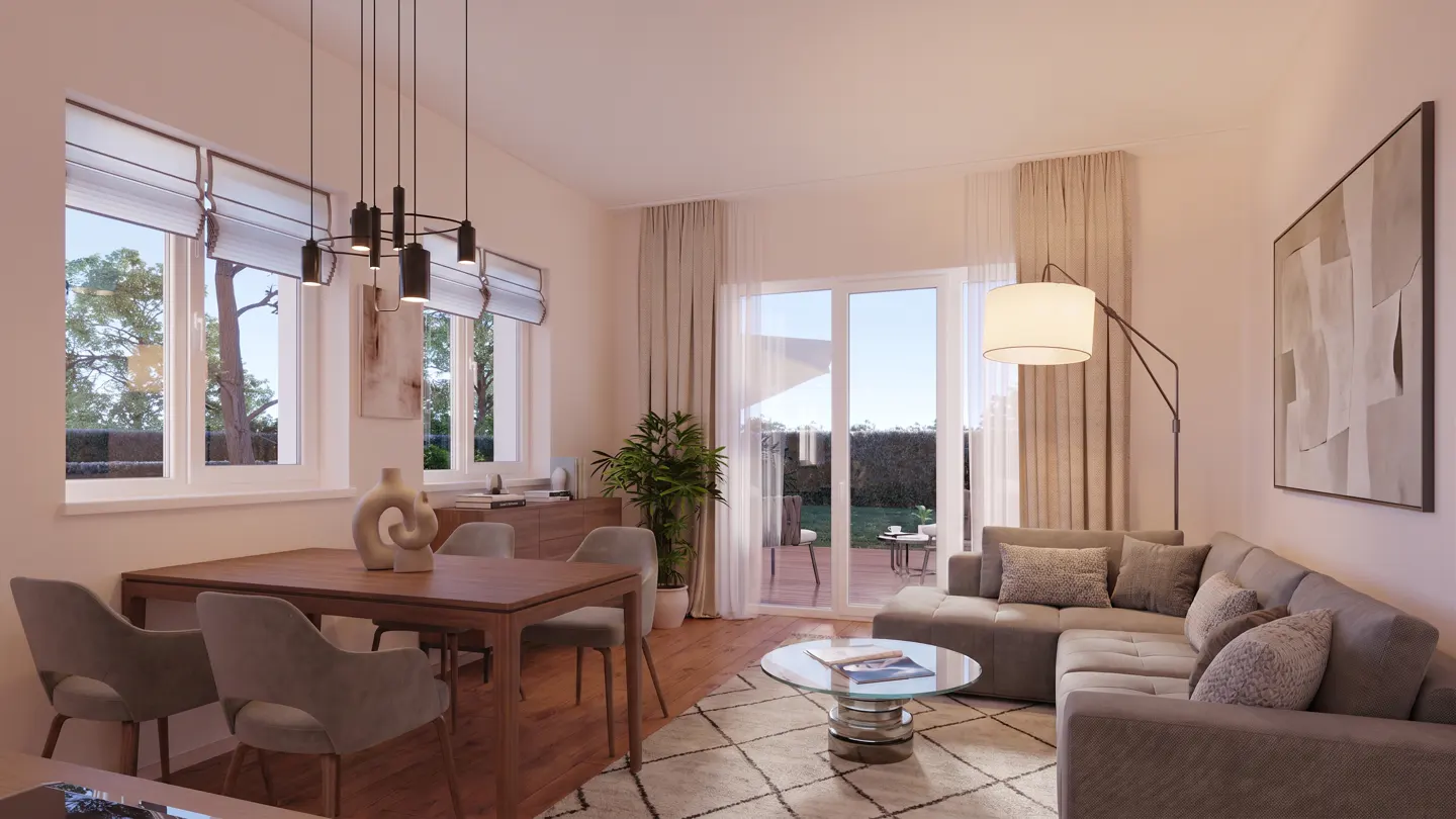 A bright living room with a dining table, gray sofa, and a view of the backyard through sliding glass doors.
