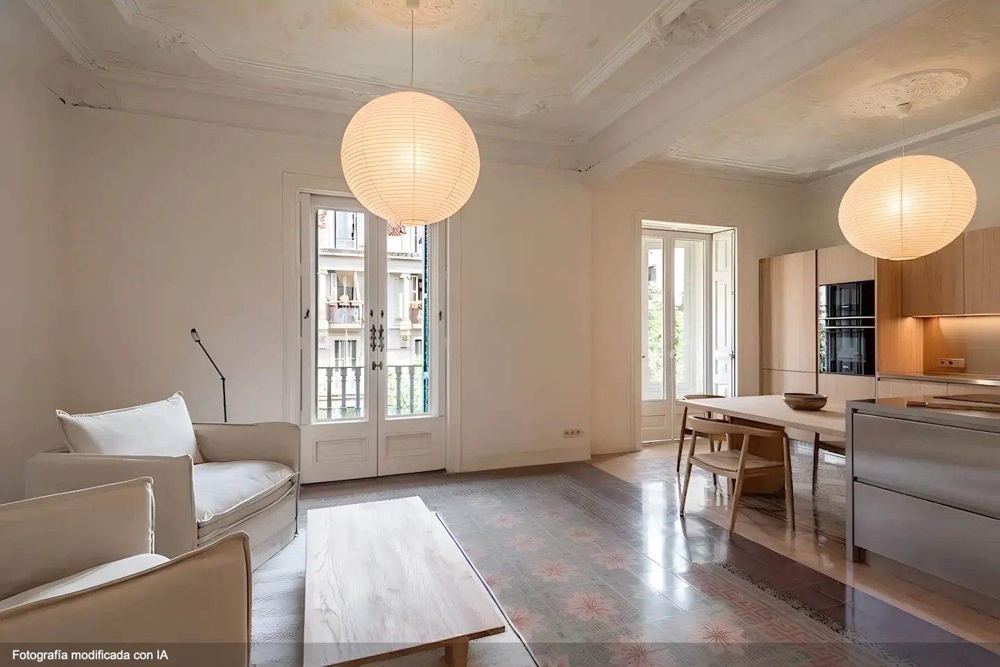 Bright, open apartment interior with white walls, patterned tile floor, and paper lantern lighting. Balcony doors and kitchen visible.