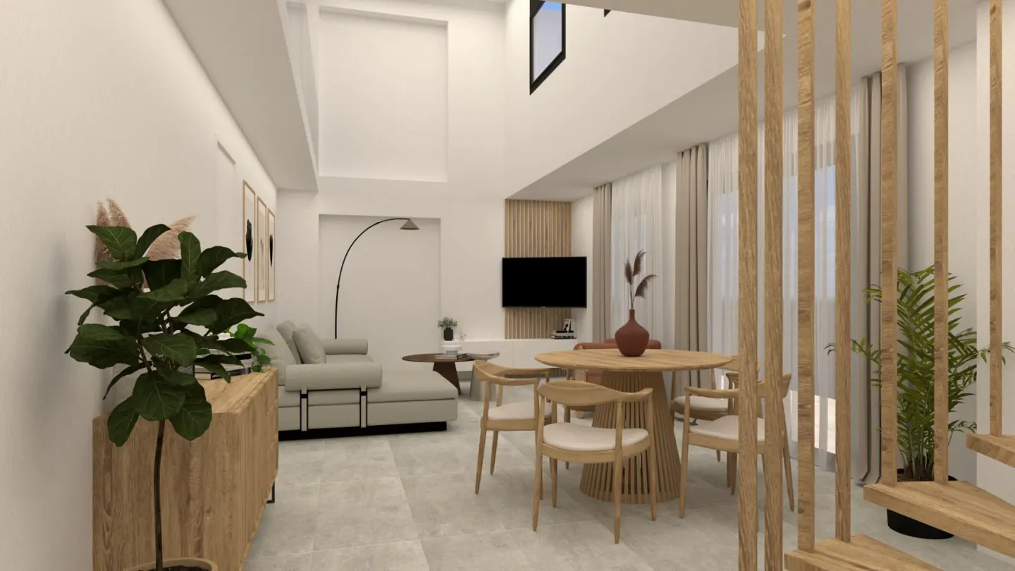 Bright, modern living room with a light gray sofa, wood table and chairs, and a large plant. A black TV is mounted on a wood-paneled wall.