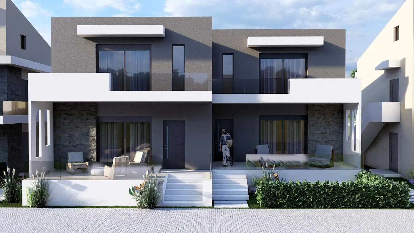 Modern two-story duplex with gray walls, white accents, and glass railings. A man and child stand at the entrance.