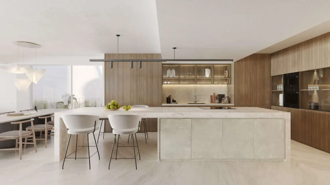 A modern kitchen with a large island, white stools, wood cabinets, and a dining table in the background.