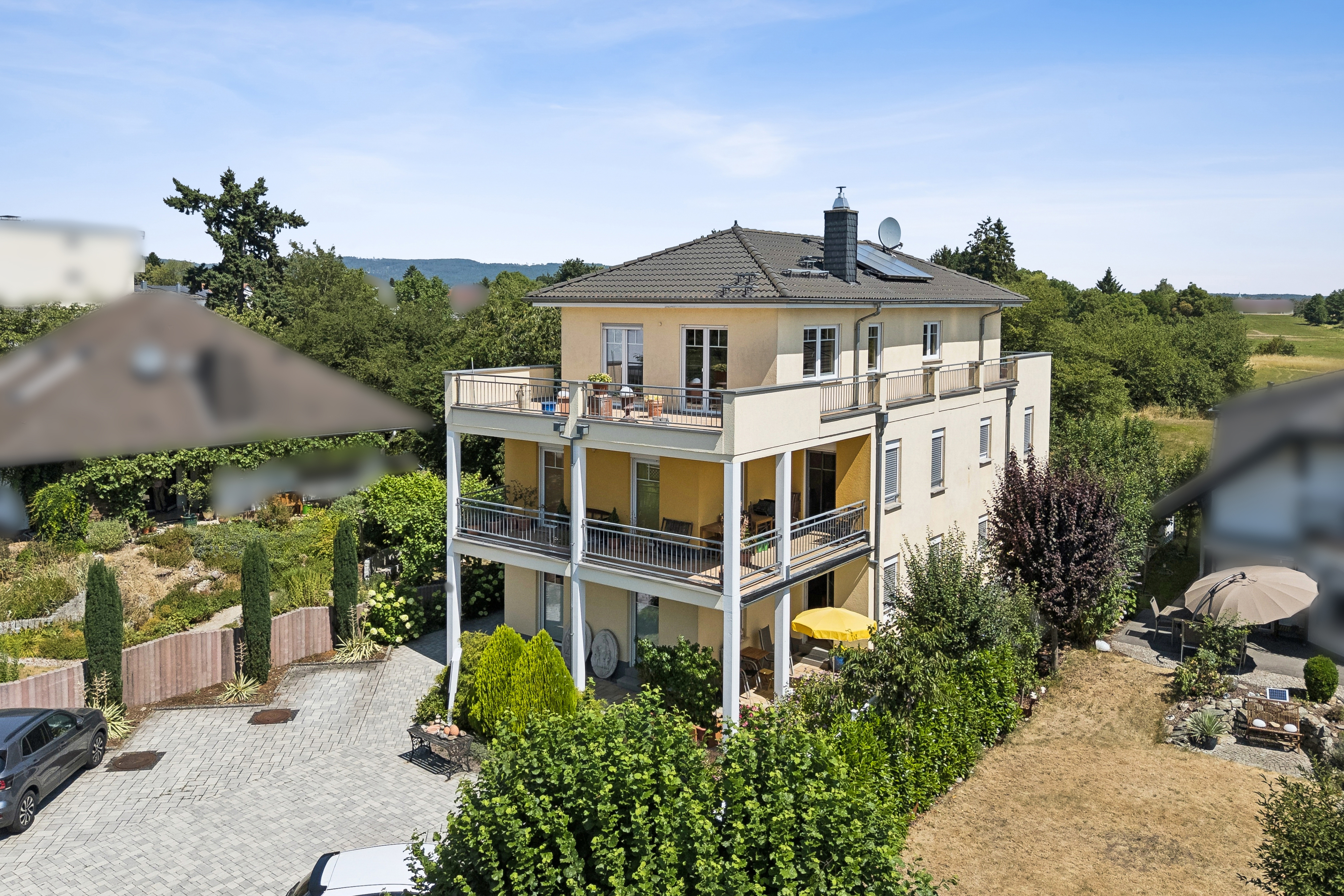 Beautiful three-unit residence in a prime location—directly by the fields, within walking distance of the center