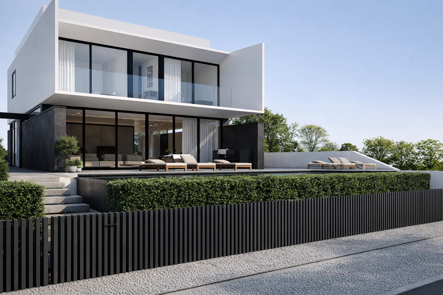 Modern two-story house with a pool and lounge chairs. The house is white with black accents and large windows.