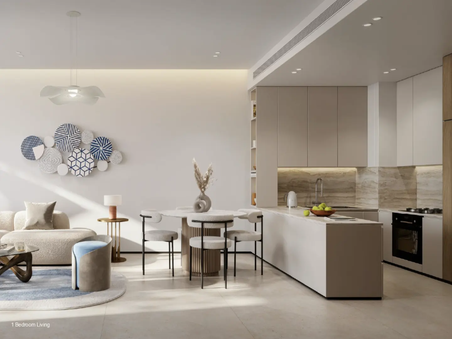 Open-concept living space with a beige sofa, round table with chairs, and a modern kitchen with white cabinets.