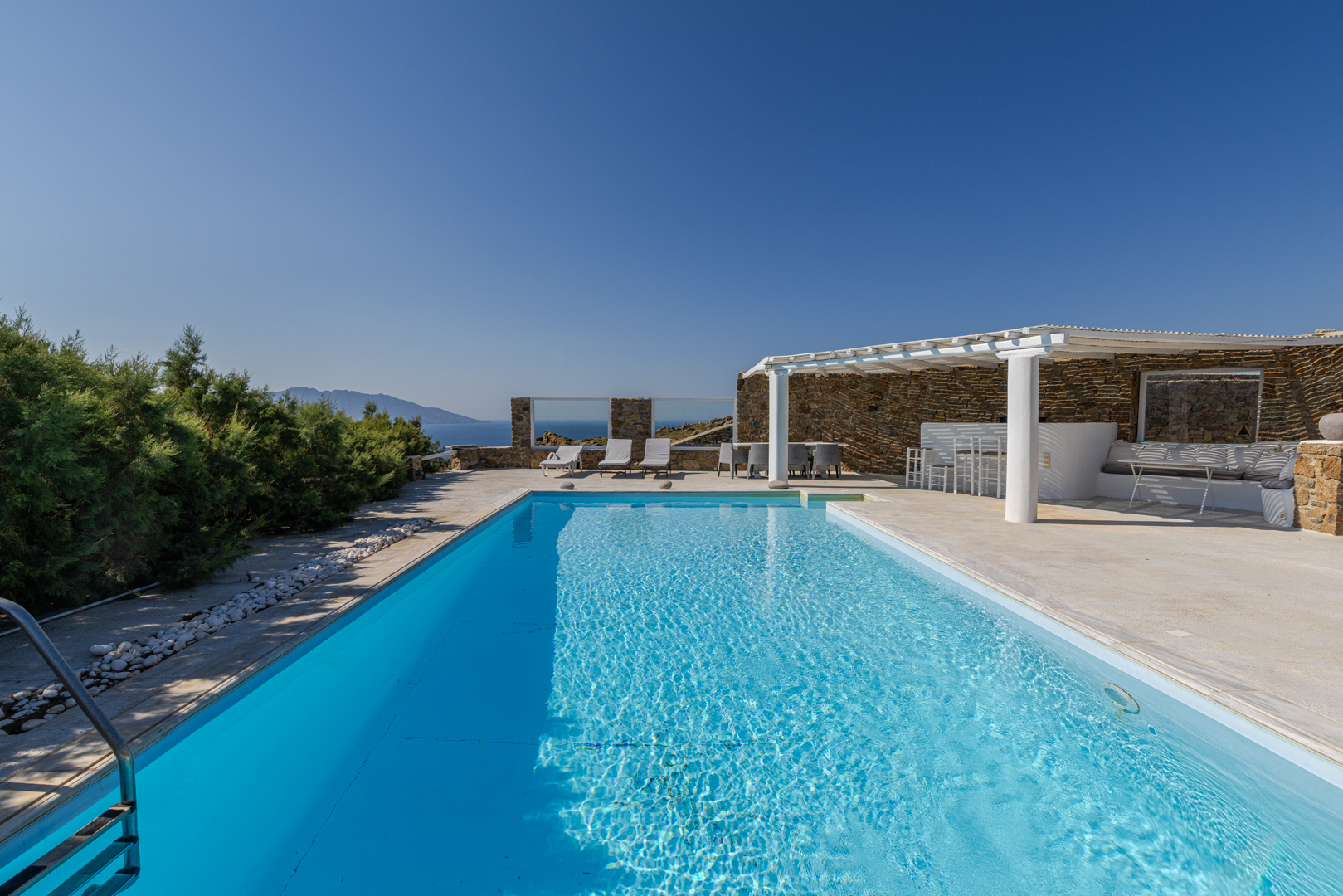 Cycladic villa with iconic lighthouse views & private guesthouses in Mykonos