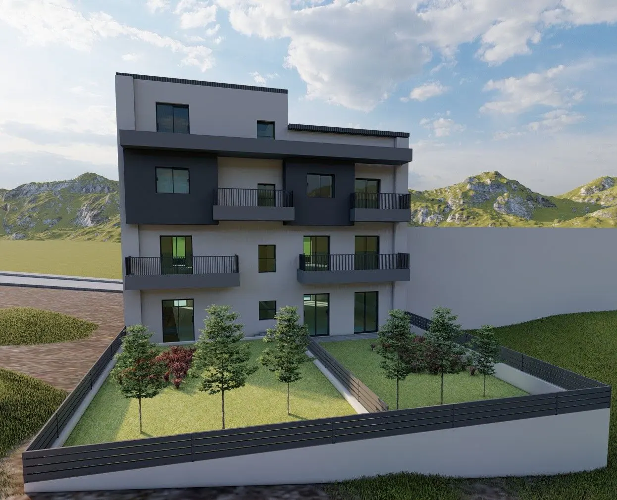 Three-story gray building with dark gray accents, balconies, and a fenced-in yard with trees and grass. Mountains and blue sky in the background.