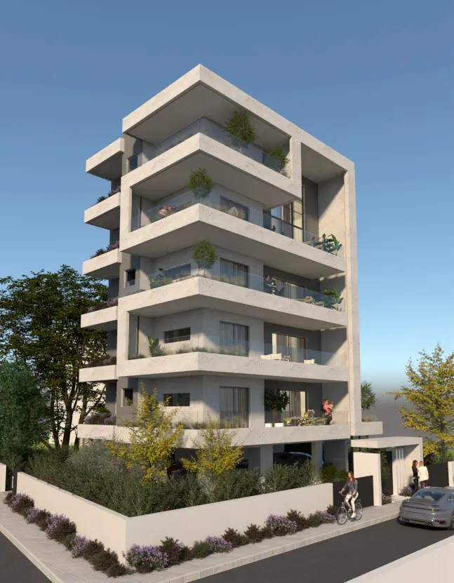 Modern multi-story apartment building with cantilevered balconies, glass railings, and surrounding greenery under blue sky.