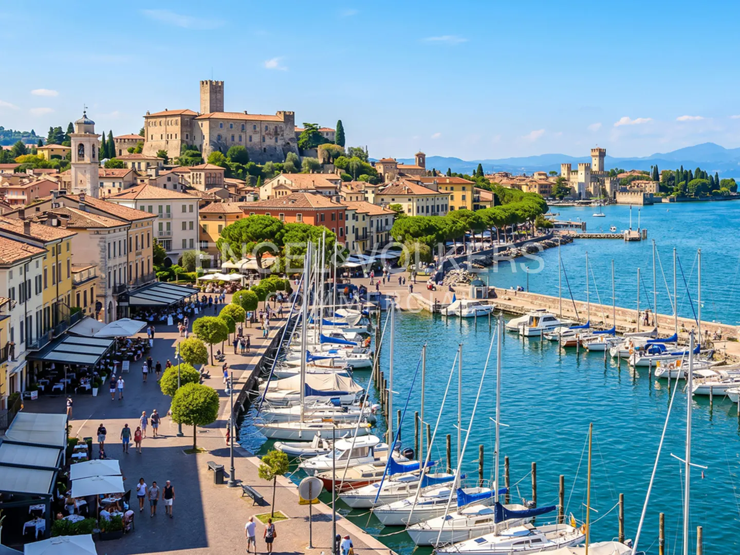 Scenic view of Sirmione, Italy, featuring a harbor filled with white sailboats, a waterfront promenade with people, and a medieval castle in the background.