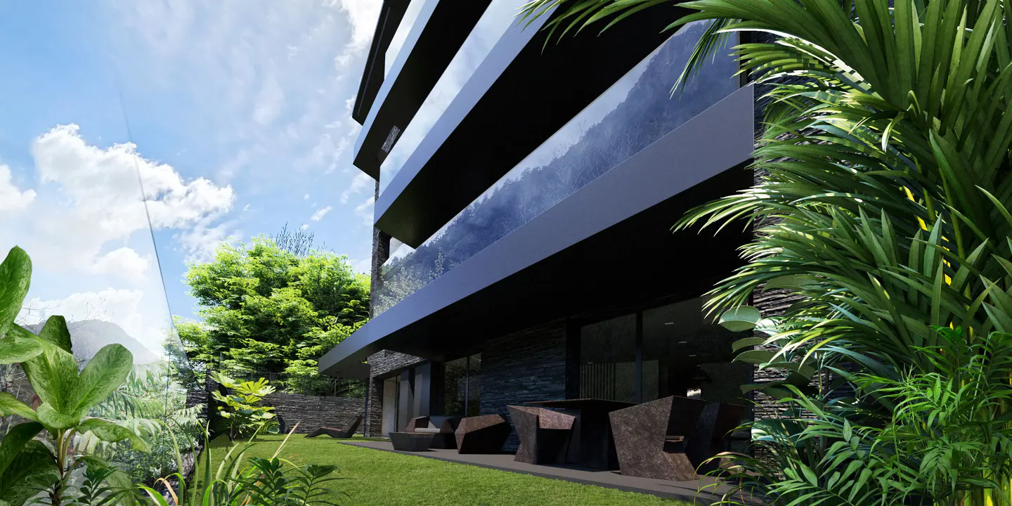 Modern black building with glass balconies, green lawn, and tropical plants under a blue sky with white clouds. Outdoor seating area.