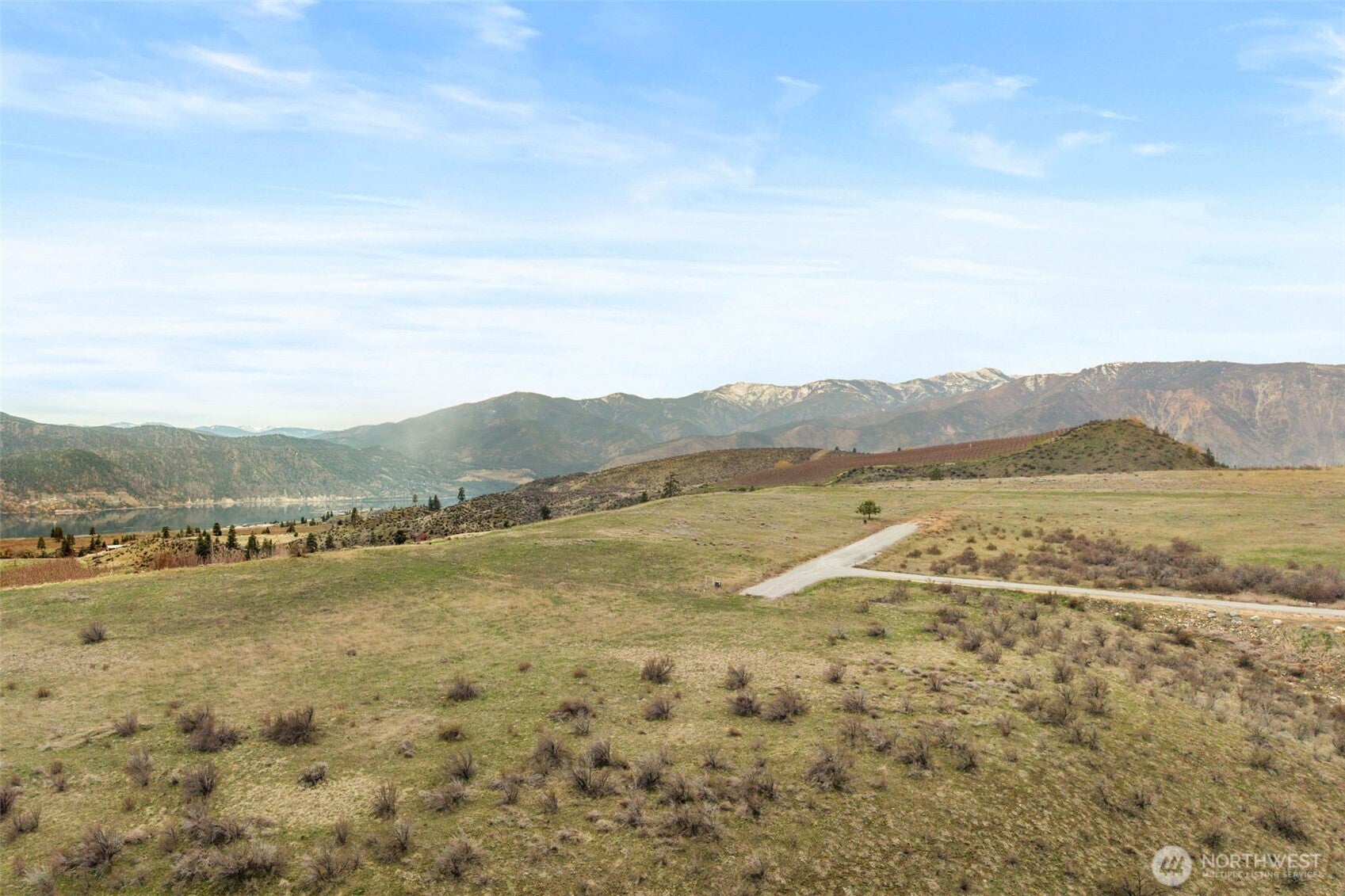 Scenic Acreage Surrounded by Orchards and Open Sky