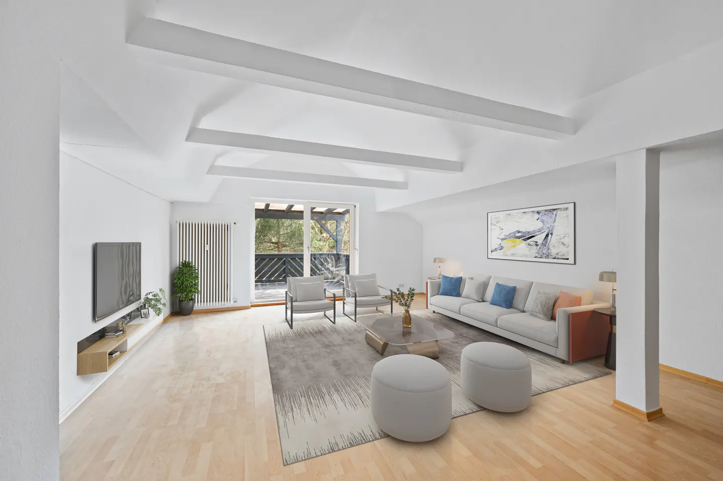 Bright, modern living room with white walls, wood floors, and a balcony. A gray sofa and chairs sit on a patterned rug.