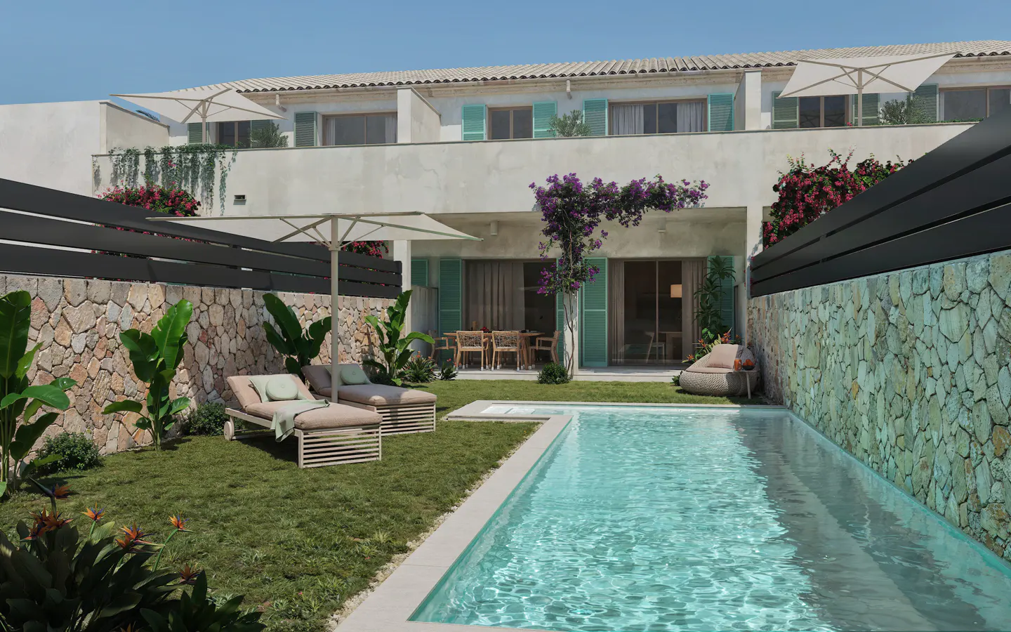 A private backyard with a swimming pool, two lounge chairs on grass, stone walls, and a modern two-story villa in the back.