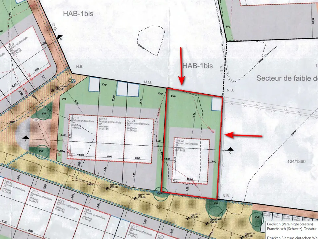 Real estate plot map showing lot divisions outlined in red, with arrows pointing to the lots. Text and measurements are visible.