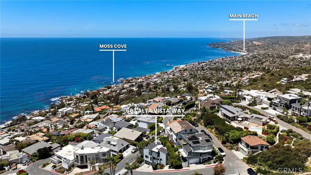 Aerial view of 683 Alta Vista Way, a coastal property with ocean views of Moss Cove and Main Beach in Laguna Beach, California.