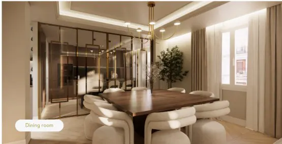 A dining room with a square wooden table surrounded by white chairs. A gold chandelier hangs above, and a glass partition separates the space.