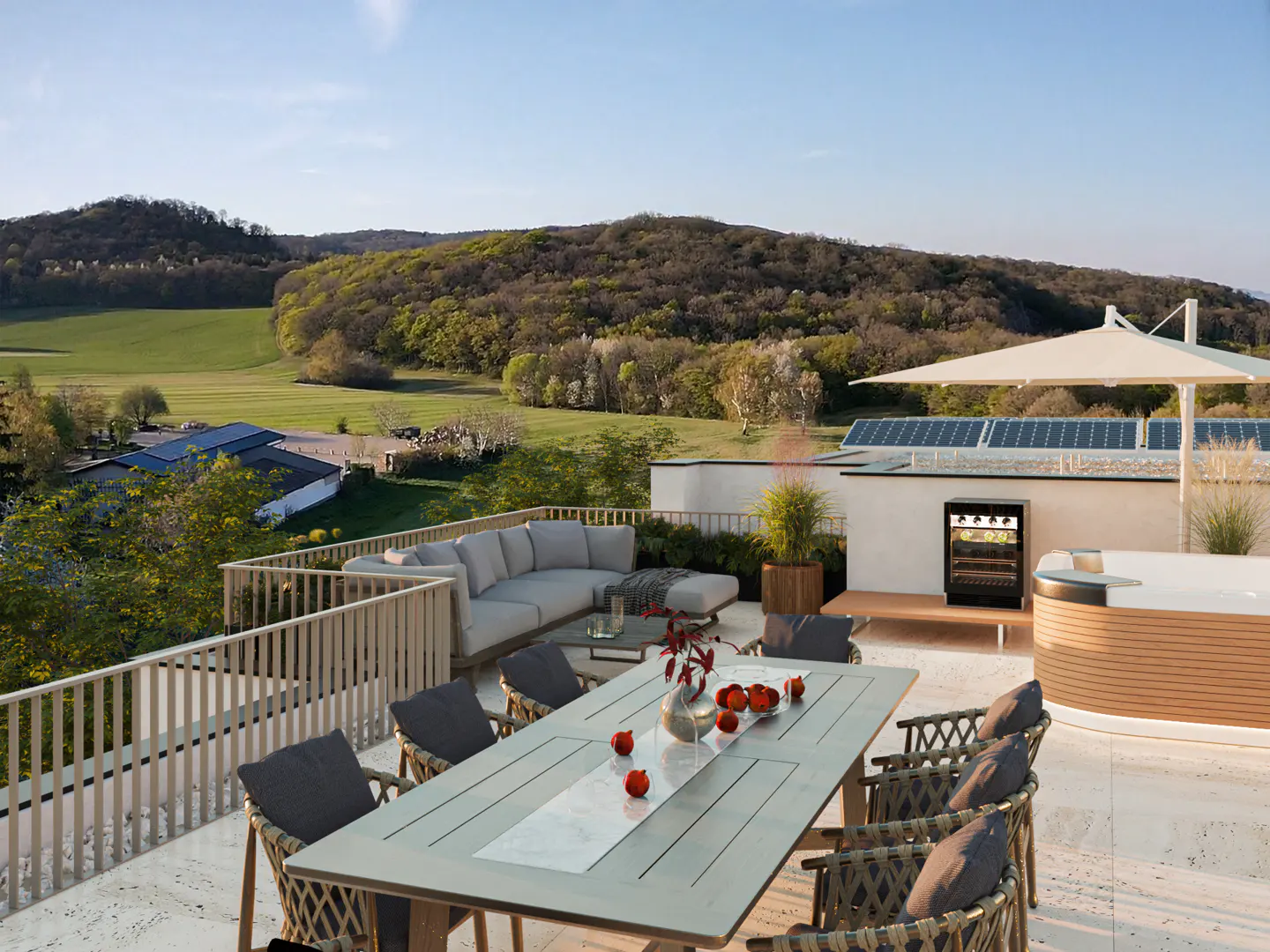 Outdoor patio with dining table, sofa, hot tub, and wine fridge. Rolling hills and blue sky in the background.