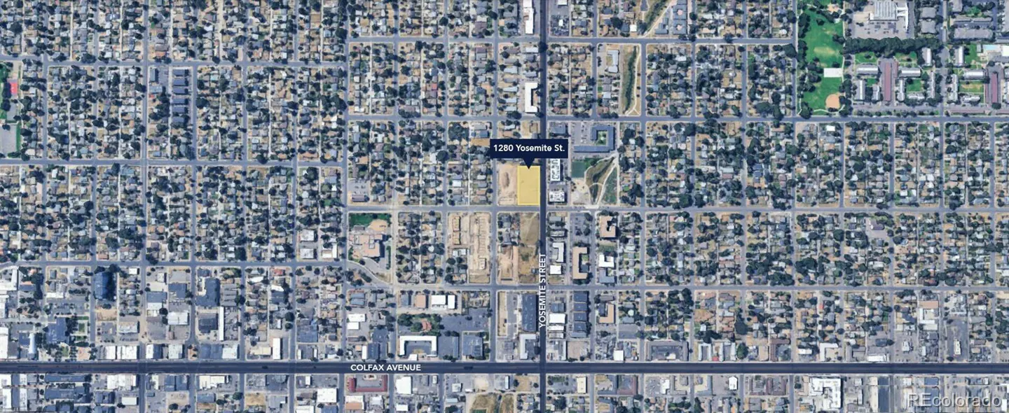 Aerial view of a neighborhood with houses, trees, and streets. "1280 Yosemite St." is marked on a yellow lot. Colfax Avenue is at the bottom.