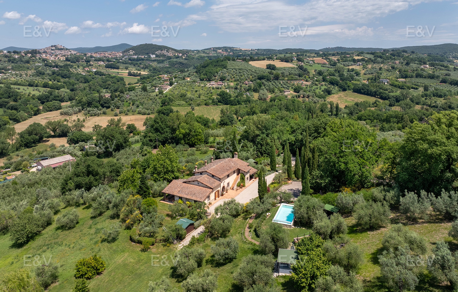 An elegant farmhouse set amongst olive trees and rolling hills, overlooking Amelia