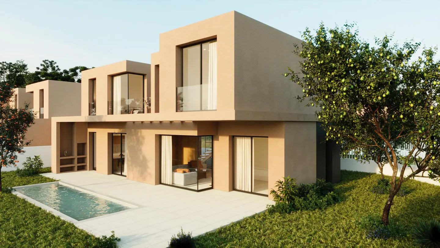 Exterior view of a modern, two-story beige house with a pool, patio, and green lawn. Large windows and a tree with green fruit are visible.