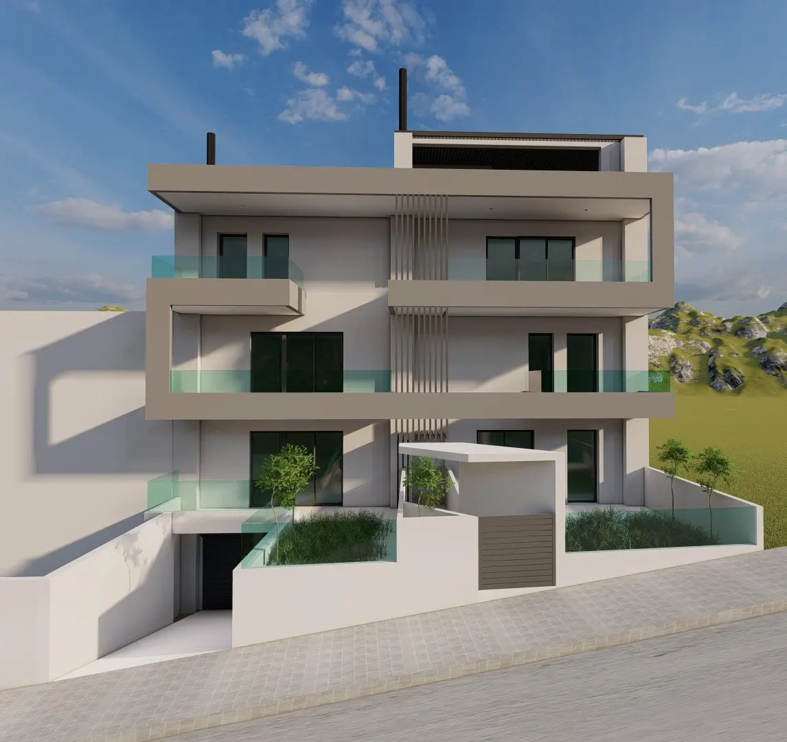 Modern three-story building with gray trim and glass balconies, set against a blue sky and green hills. A garage is visible on the left.